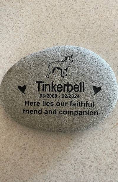 Engraved pet memorial with text Tinkerbell 03/2008 - 02/2024 Here lies our faithful friend and companion with a custom graphic of the cat
