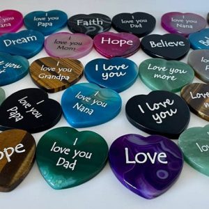 Love stones in the shape of a heart with various colors with engraved text