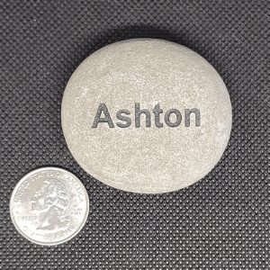 Name Stones next to a quarter with the name Ashton