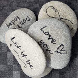 a group of rocks with writing on them