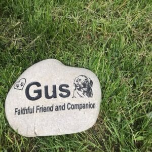 a stone with a picture of a dog on it
